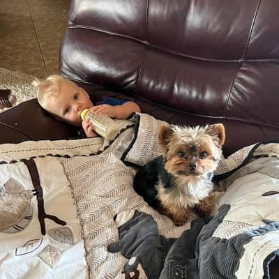 Baby and Yorkie on couch
