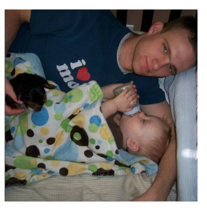 Todd with baby and pup 2011