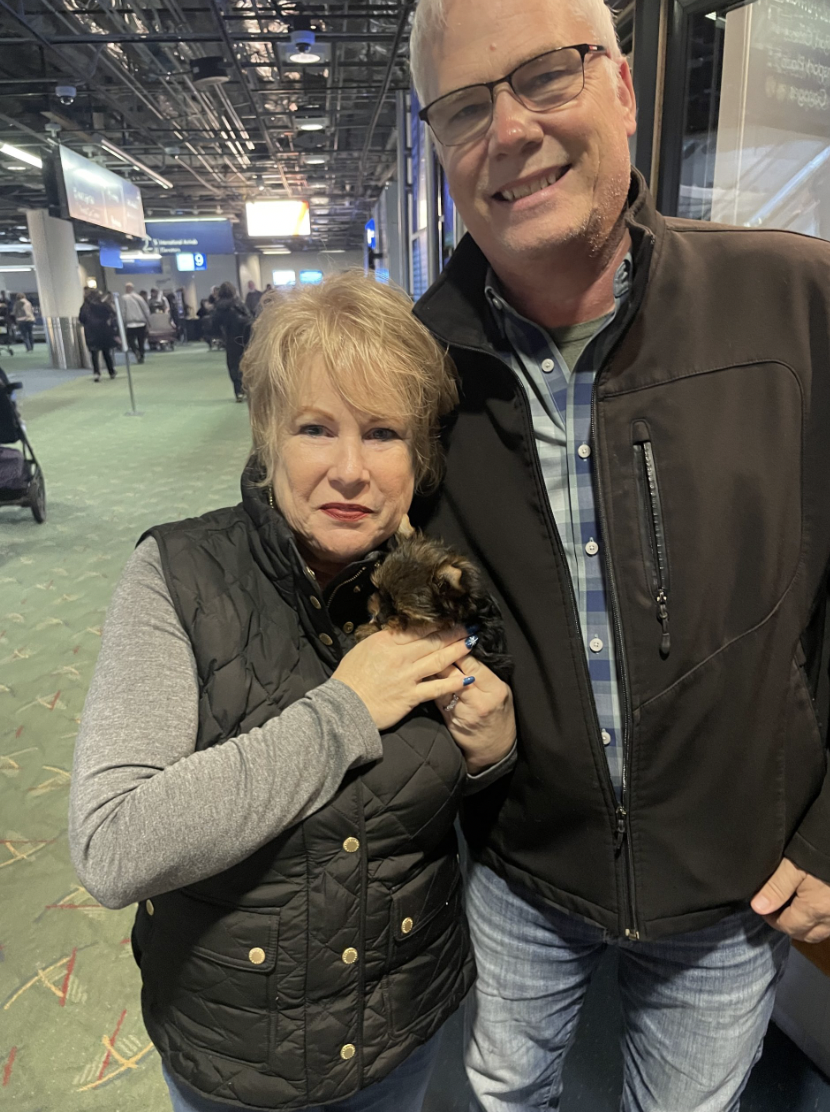 Karen Parsons with their Doll Face Pup