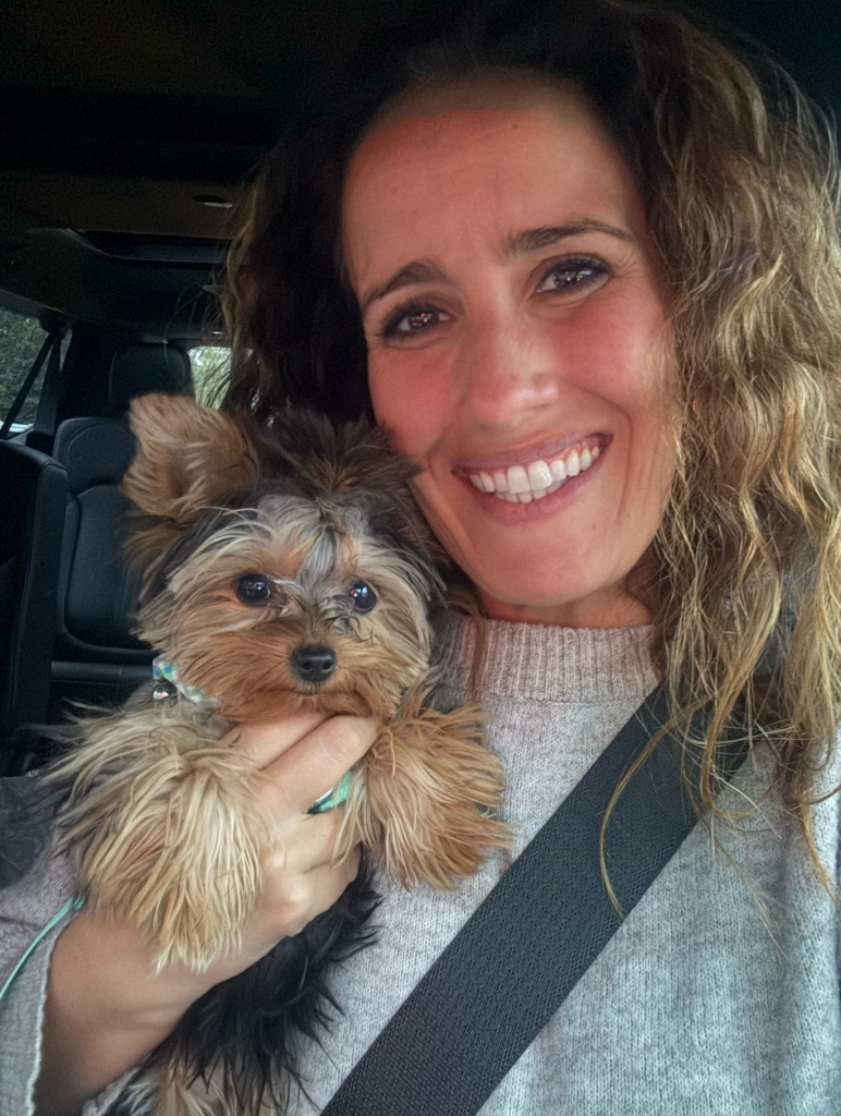 Ali Allred with their Doll Face Pup